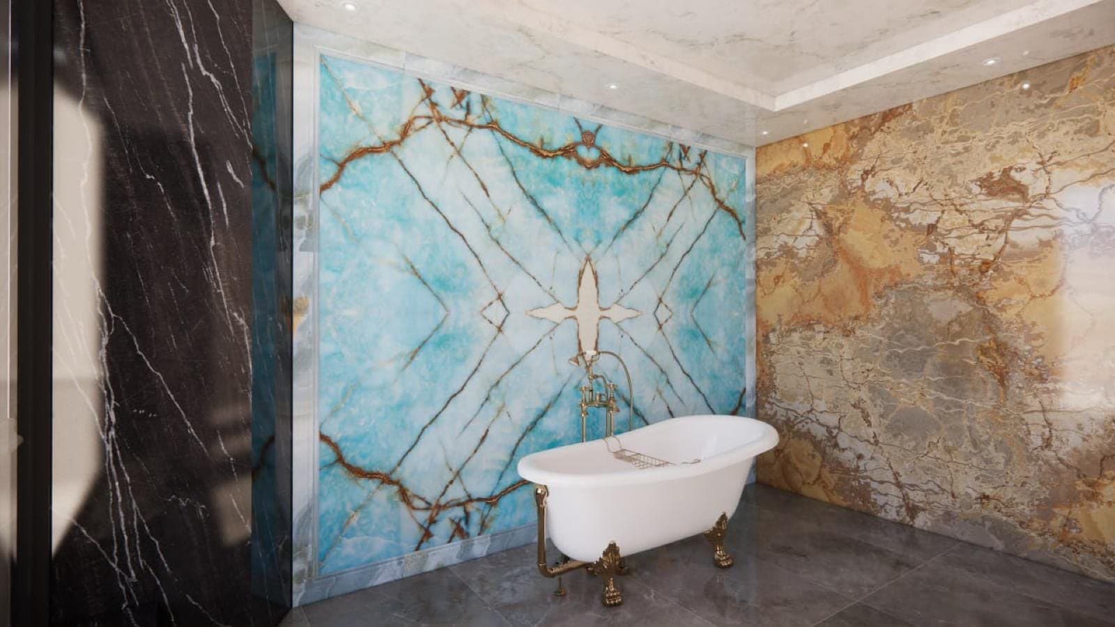 Baignoire sur pieds entre un mur de marbre noir et un mur de marbre doré